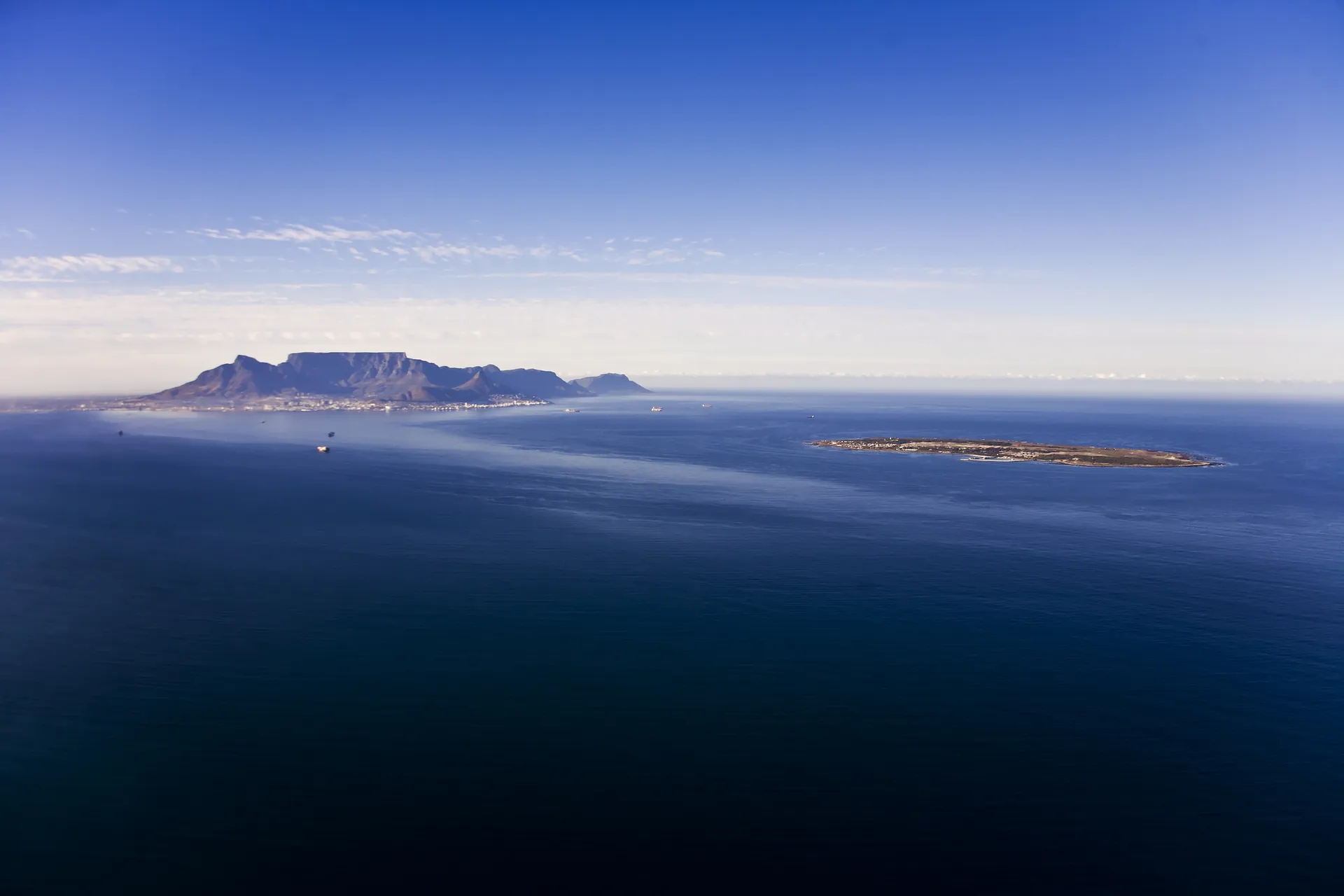 Aerial view of Robben Island in Table Bay, with Table Mountain and Cape Town behind