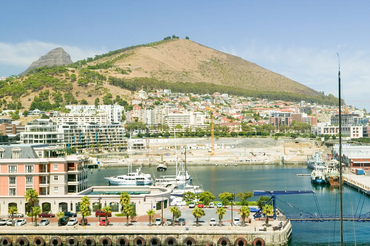 Cape Grace on its quay at the V&A Waterfront, with Signal Hill behind