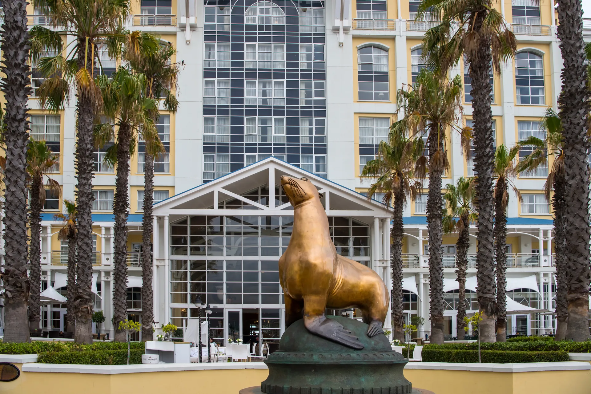 The Table Bay Hotel with its bronze seal statue and palm trees