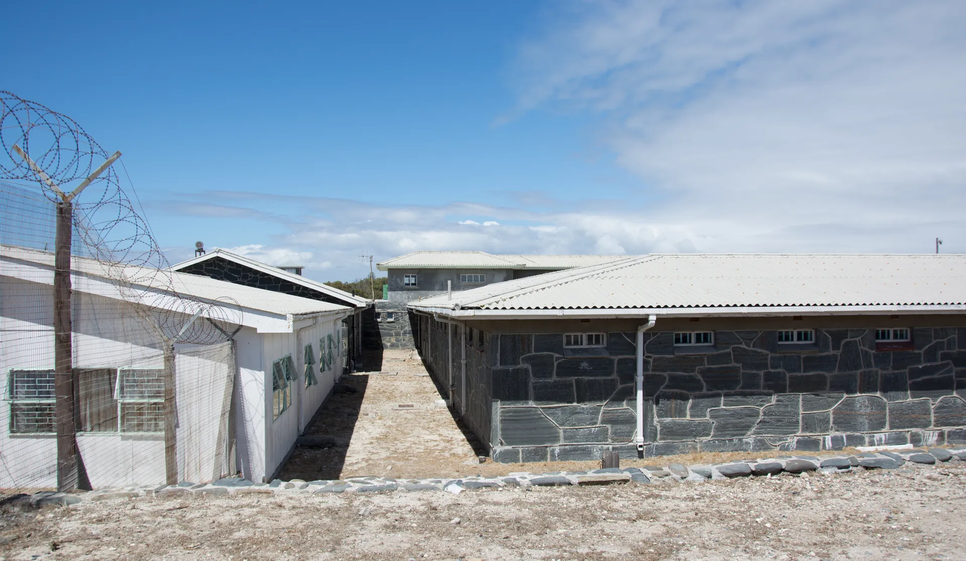 Prison blocks behind barbed wire on Robben Island