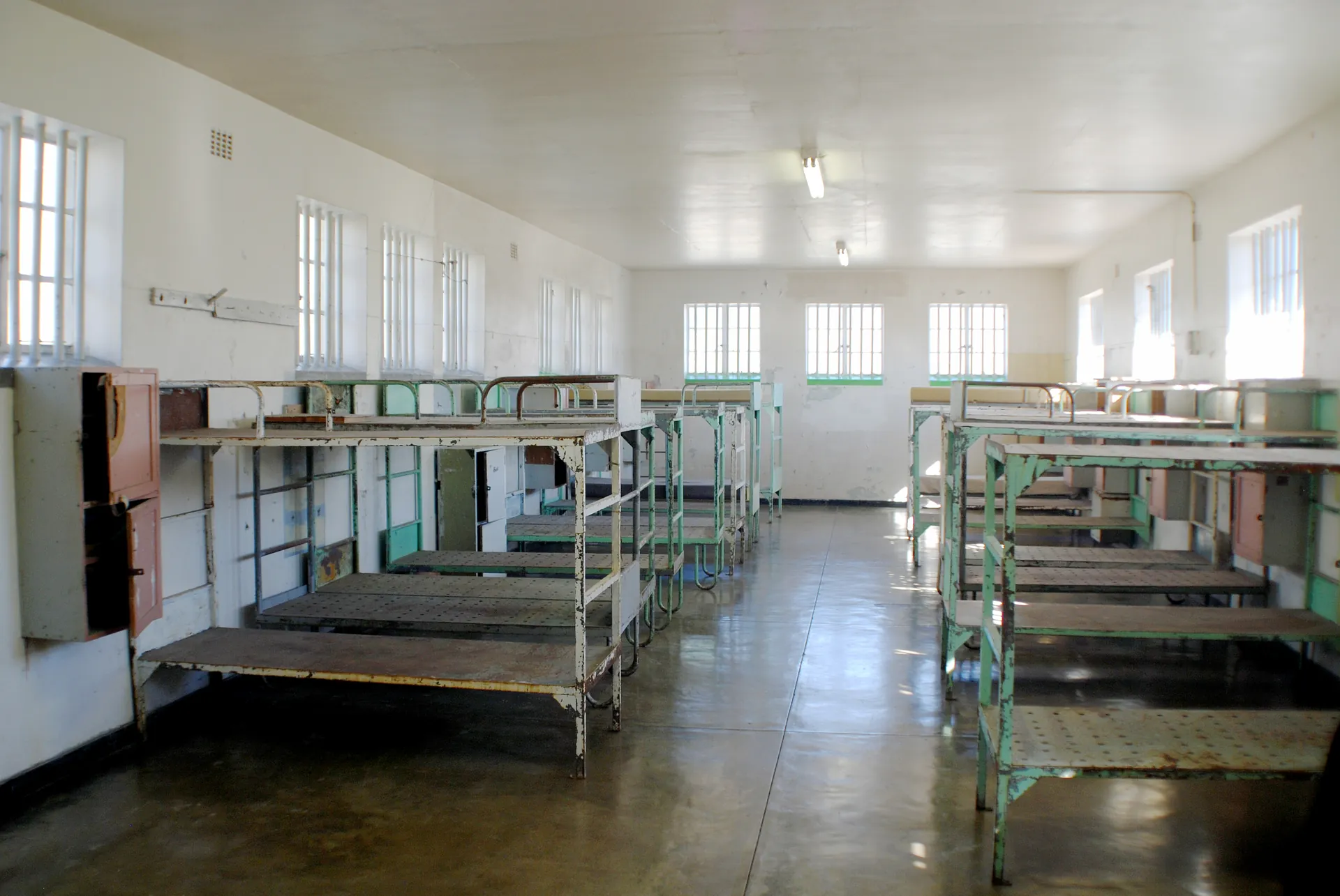 A communal cell with rows of bunk beds in the general sections of the prison