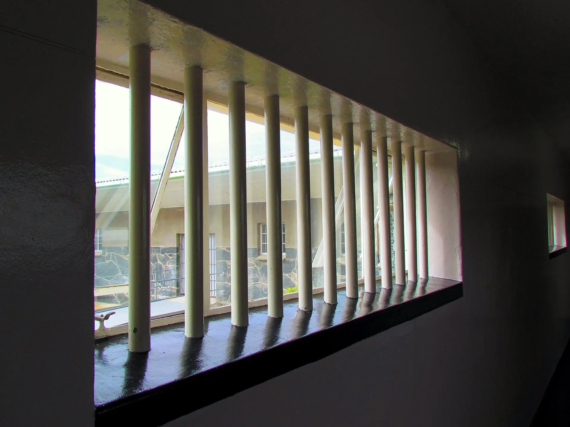 Light coming through the barred windows of the prison on Robben Island